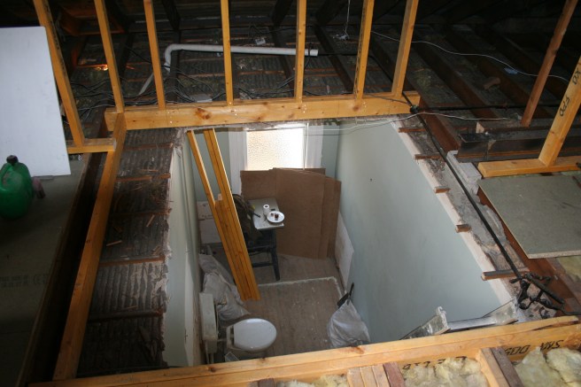 down to old bathroom, the space framed in timber is where the stair will go