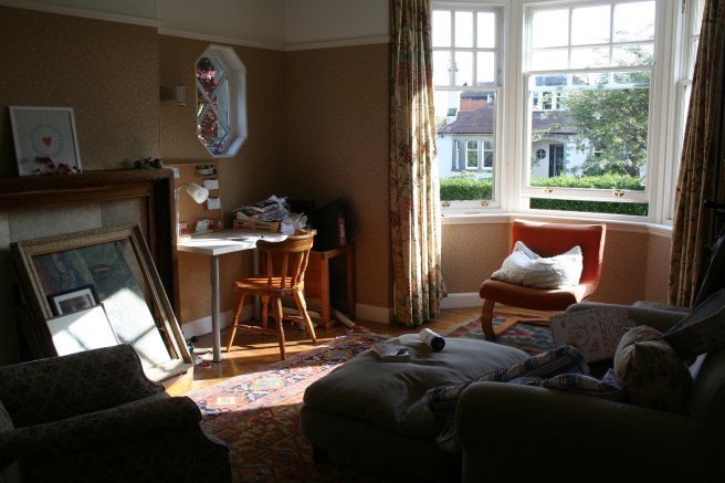 slightly useable front room with L's desk