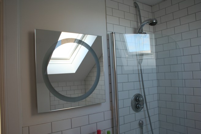 the mirror turns into a light when you wave your hand underneath it. clever. C's choice.