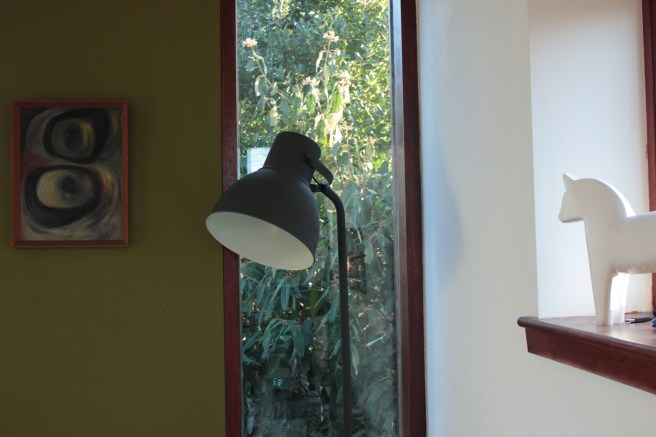 the far corner in the garden room with the sun streaming in